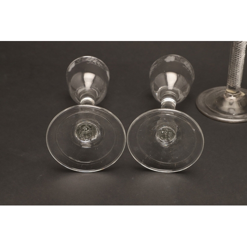 627 - 18THC WINE GLASSES. Including a pair of wine glasses, the bowls engraved with fruiting vine and with... 