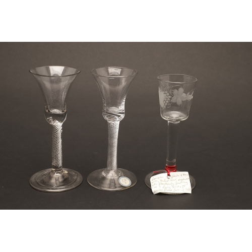 627 - 18THC WINE GLASSES. Including a pair of wine glasses, the bowls engraved with fruiting vine and with... 