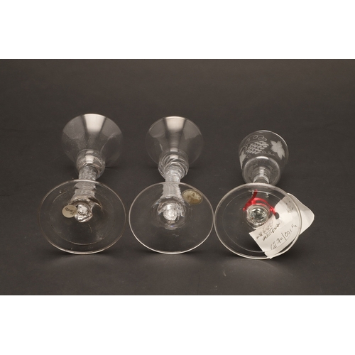 627 - 18THC WINE GLASSES. Including a pair of wine glasses, the bowls engraved with fruiting vine and with... 