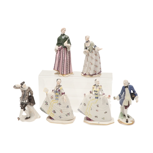 634 - NYMPHENBURG PORCELAIN FIGURES. Including two similar figures with one holding a fan (18cms high), an... 