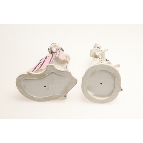 634 - NYMPHENBURG PORCELAIN FIGURES. Including two similar figures with one holding a fan (18cms high), an... 