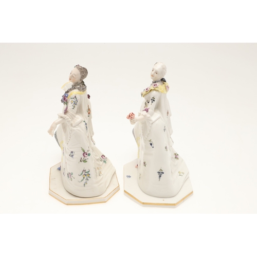 634 - NYMPHENBURG PORCELAIN FIGURES. Including two similar figures with one holding a fan (18cms high), an... 