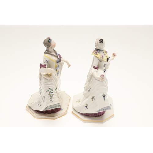 634 - NYMPHENBURG PORCELAIN FIGURES. Including two similar figures with one holding a fan (18cms high), an... 