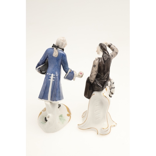 634 - NYMPHENBURG PORCELAIN FIGURES. Including two similar figures with one holding a fan (18cms high), an... 