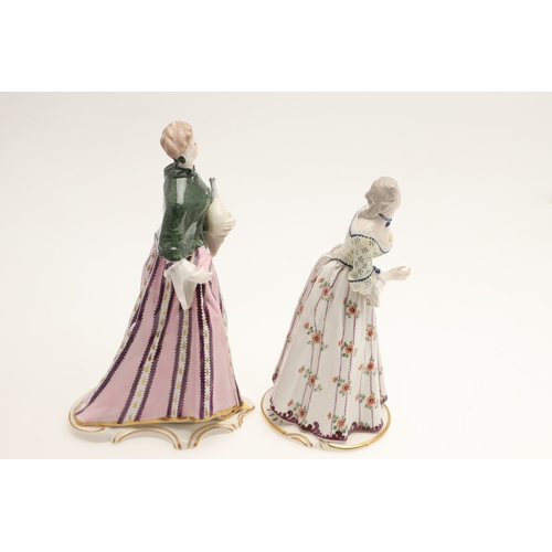 634 - NYMPHENBURG PORCELAIN FIGURES. Including two similar figures with one holding a fan (18cms high), an... 