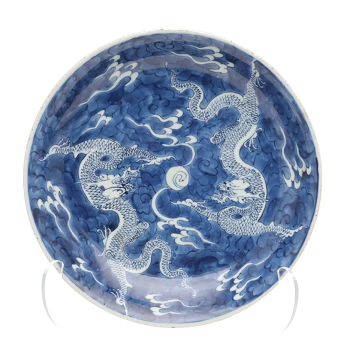 662 - 19THC CHINESE PORCELAIN DRAGON DISH. 19thc, the large dish painted with Dragons chasing a flaming pe... 
