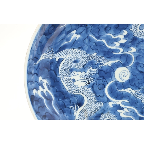 662 - 19THC CHINESE PORCELAIN DRAGON DISH. 19thc, the large dish painted with Dragons chasing a flaming pe... 