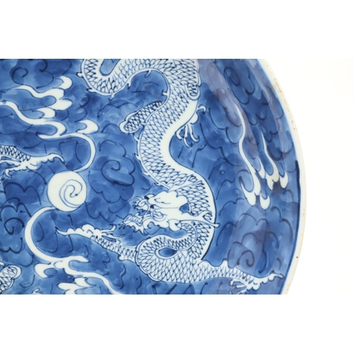 662 - 19THC CHINESE PORCELAIN DRAGON DISH. 19thc, the large dish painted with Dragons chasing a flaming pe... 