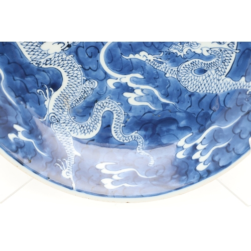 662 - 19THC CHINESE PORCELAIN DRAGON DISH. 19thc, the large dish painted with Dragons chasing a flaming pe... 
