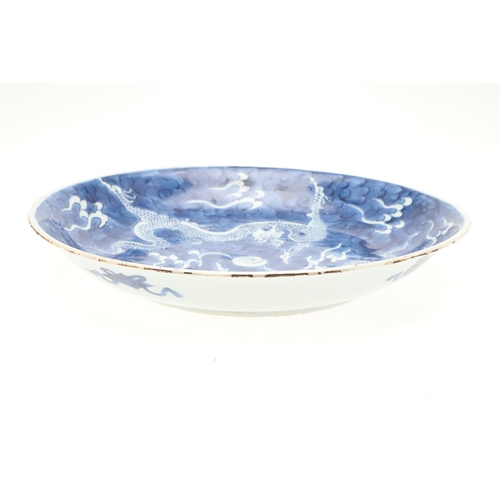 662 - 19THC CHINESE PORCELAIN DRAGON DISH. 19thc, the large dish painted with Dragons chasing a flaming pe... 