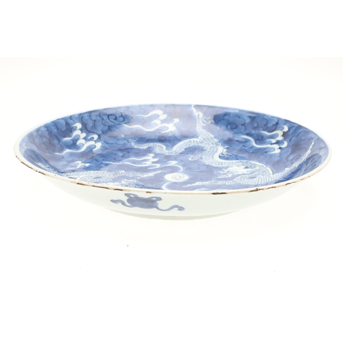 662 - 19THC CHINESE PORCELAIN DRAGON DISH. 19thc, the large dish painted with Dragons chasing a flaming pe... 