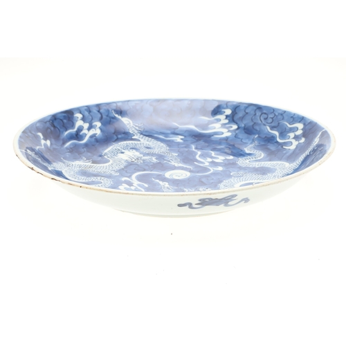 662 - 19THC CHINESE PORCELAIN DRAGON DISH. 19thc, the large dish painted with Dragons chasing a flaming pe... 