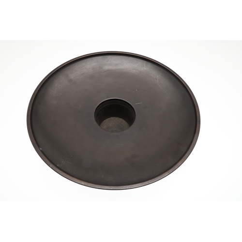 666 - JAPANESE BRONZE FIGURAL STAND. A bronze circular top stand made in two sections, supported by a figu... 