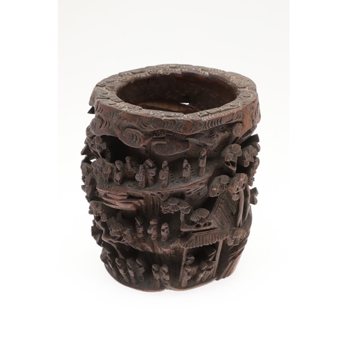 676 - CHINESE BAMBOO BRUSH POT. 19thc, of circular form and carved with a variety of figures amongst trees... 