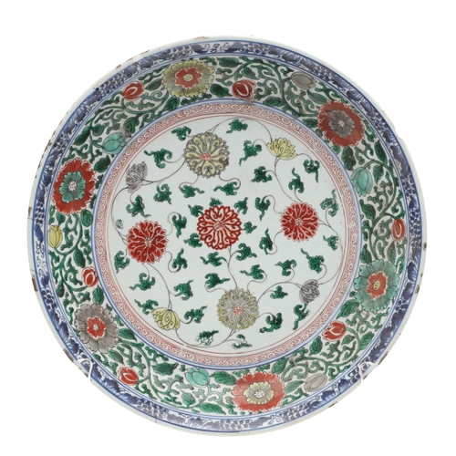 680 - LARGE CHINESE FAMILLE VERTE DISH. Kangxi period (1662-1722), the large shallow dish painted with a v... 