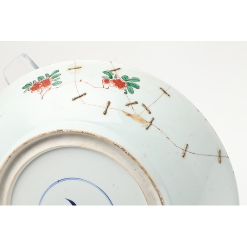 680 - LARGE CHINESE FAMILLE VERTE DISH. Kangxi period (1662-1722), the large shallow dish painted with a v... 