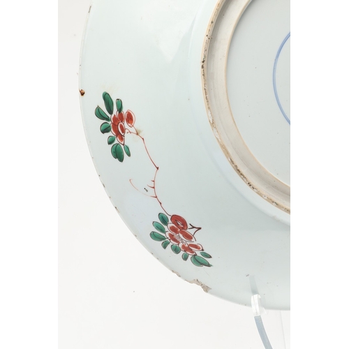 680 - LARGE CHINESE FAMILLE VERTE DISH. Kangxi period (1662-1722), the large shallow dish painted with a v... 