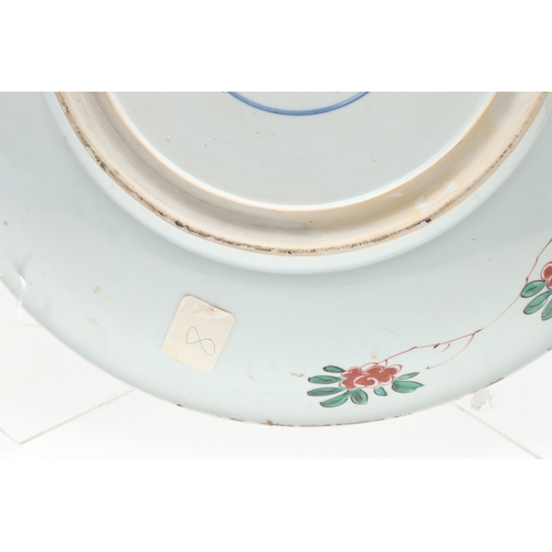 680 - LARGE CHINESE FAMILLE VERTE DISH. Kangxi period (1662-1722), the large shallow dish painted with a v... 