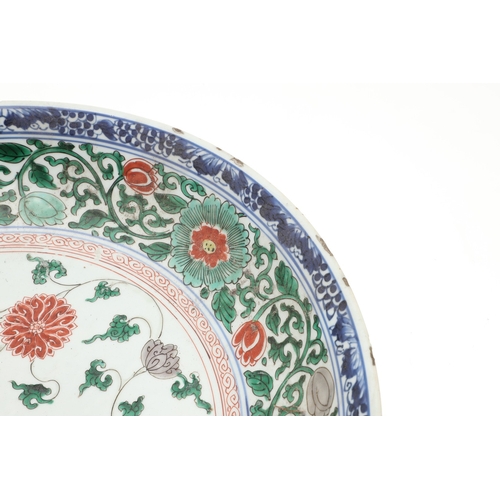 680 - LARGE CHINESE FAMILLE VERTE DISH. Kangxi period (1662-1722), the large shallow dish painted with a v... 