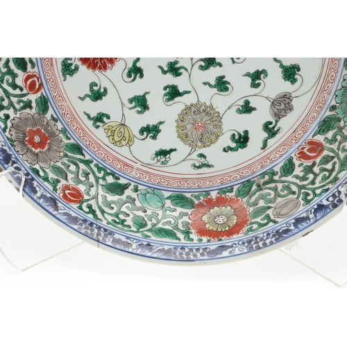 680 - LARGE CHINESE FAMILLE VERTE DISH. Kangxi period (1662-1722), the large shallow dish painted with a v... 