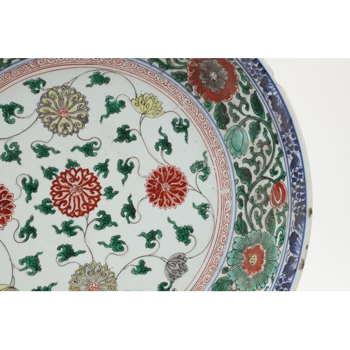 680 - LARGE CHINESE FAMILLE VERTE DISH. Kangxi period (1662-1722), the large shallow dish painted with a v... 