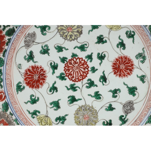 680 - LARGE CHINESE FAMILLE VERTE DISH. Kangxi period (1662-1722), the large shallow dish painted with a v... 