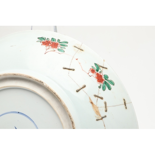 680 - LARGE CHINESE FAMILLE VERTE DISH. Kangxi period (1662-1722), the large shallow dish painted with a v... 