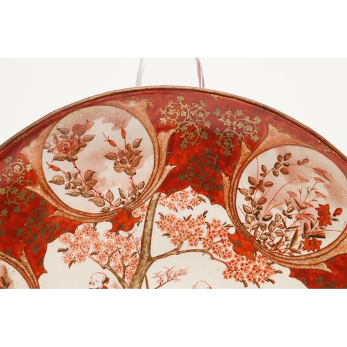 683 - JAPANESE KUTANI CHARGER. Painted to the centre with various scholars by a tree in blossom, also pain... 
