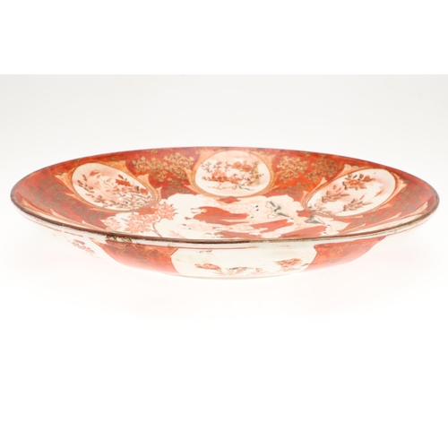 683 - JAPANESE KUTANI CHARGER. Painted to the centre with various scholars by a tree in blossom, also pain... 