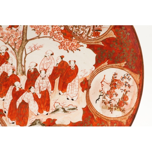 683 - JAPANESE KUTANI CHARGER. Painted to the centre with various scholars by a tree in blossom, also pain... 