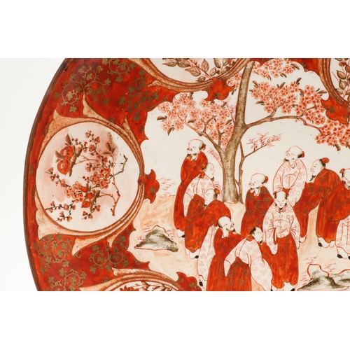 683 - JAPANESE KUTANI CHARGER. Painted to the centre with various scholars by a tree in blossom, also pain... 