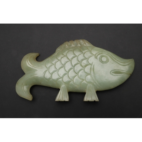 700 - CHINESE JADE FISH. Late Qing, the celadon jade fish of narrow form and with carved detailing. With a... 