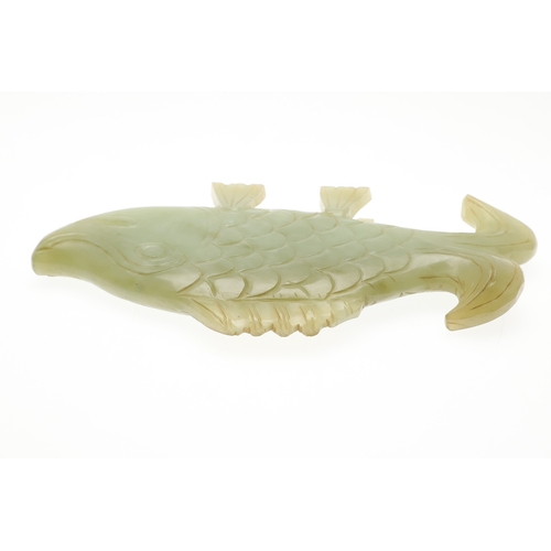 700 - CHINESE JADE FISH. Late Qing, the celadon jade fish of narrow form and with carved detailing. With a... 