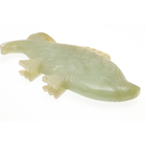 700 - CHINESE JADE FISH. Late Qing, the celadon jade fish of narrow form and with carved detailing. With a... 