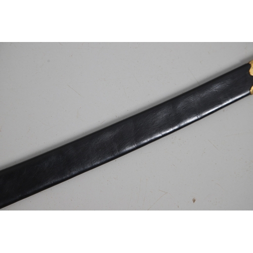 111 - A FRENCH NAPOLEONIC PERIOD INFANTRY OFFICER'S SWORD AND SCABBARD. With a 72 cm curved blade with poi... 