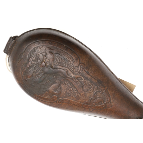 61 - TWO LEATHER BODIED SHOT FLASKS. A leather bodied shot flask decorated with game in a wooded landscap... 