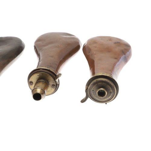 66 - A COLLECTION OF FIVE COPPER BODIED POWDER FLASKS. A mixed collection of copper bodied powder flasks ... 