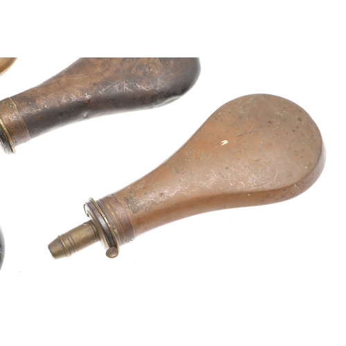 68 - A COLLECTION OF FIVE 19TH CENTURY POWDER FLASKS. A collection of five powder flasks, one with pigski... 