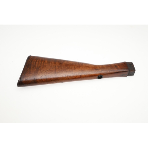 71 - A WALNUT RIFLE STOCK. A stock for a rifle with steel butt plate and small circular depression to the... 