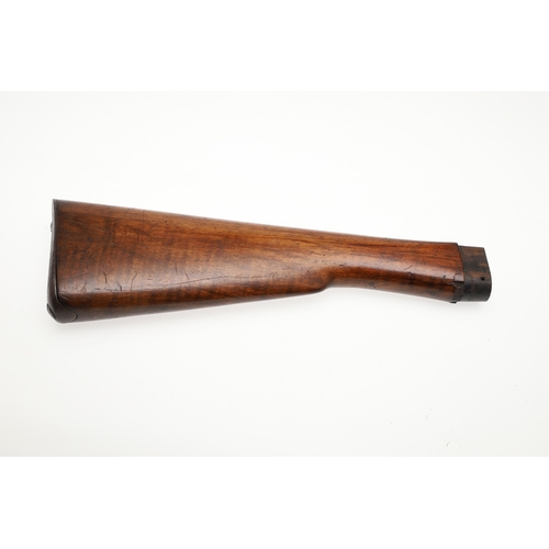 71 - A WALNUT RIFLE STOCK. A stock for a rifle with steel butt plate and small circular depression to the... 