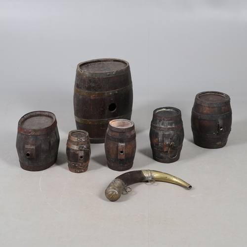73 - A COLLECTION OF POWDER OR SIMILAR BARRELS AND A BRASS MOUNTED POWDER FLASK. A collection of bound ba... 