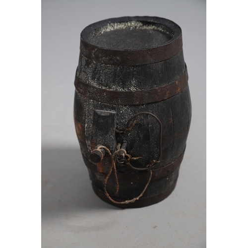 73 - A COLLECTION OF POWDER OR SIMILAR BARRELS AND A BRASS MOUNTED POWDER FLASK. A collection of bound ba... 