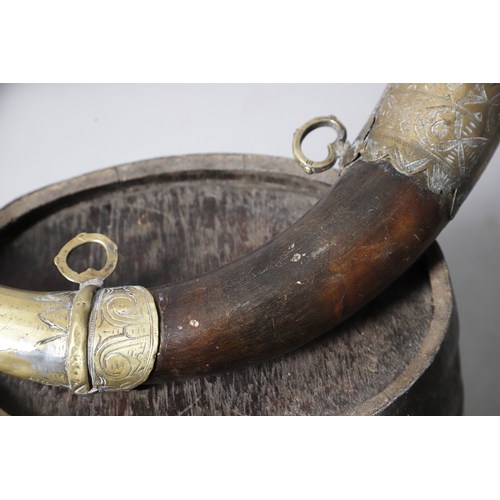 73 - A COLLECTION OF POWDER OR SIMILAR BARRELS AND A BRASS MOUNTED POWDER FLASK. A collection of bound ba... 