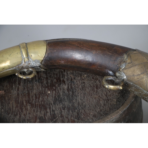 73 - A COLLECTION OF POWDER OR SIMILAR BARRELS AND A BRASS MOUNTED POWDER FLASK. A collection of bound ba... 