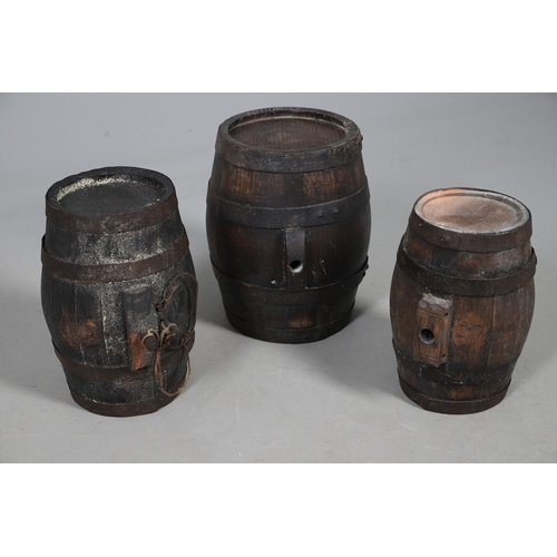 73 - A COLLECTION OF POWDER OR SIMILAR BARRELS AND A BRASS MOUNTED POWDER FLASK. A collection of bound ba... 
