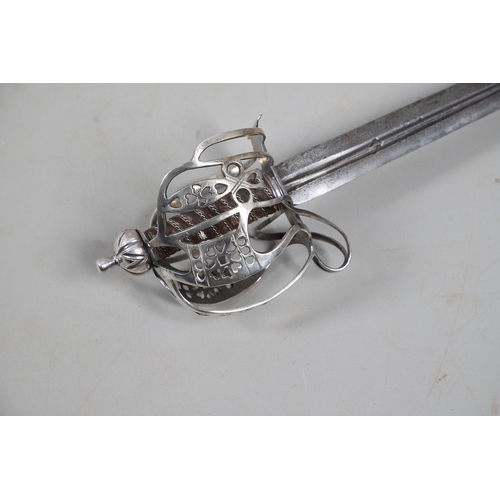 84 - AN 18TH CENTURY SCOTTISH BASKET HILTED SWORD BY ANDREA FERRARA. With an 88 cm tapering broad blade w... 