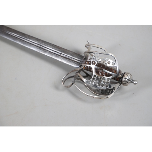 84 - AN 18TH CENTURY SCOTTISH BASKET HILTED SWORD BY ANDREA FERRARA. With an 88 cm tapering broad blade w... 