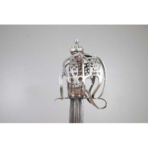 84 - AN 18TH CENTURY SCOTTISH BASKET HILTED SWORD BY ANDREA FERRARA. With an 88 cm tapering broad blade w... 