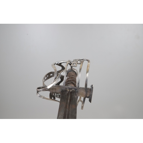 84 - AN 18TH CENTURY SCOTTISH BASKET HILTED SWORD BY ANDREA FERRARA. With an 88 cm tapering broad blade w... 