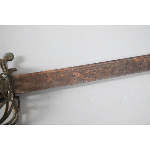 96 - A VICTORIAN 1854 PATTERN SWORD AND SCABBARD. An 1854 pattern sword with an 82 cm tapering, pointed p... 
